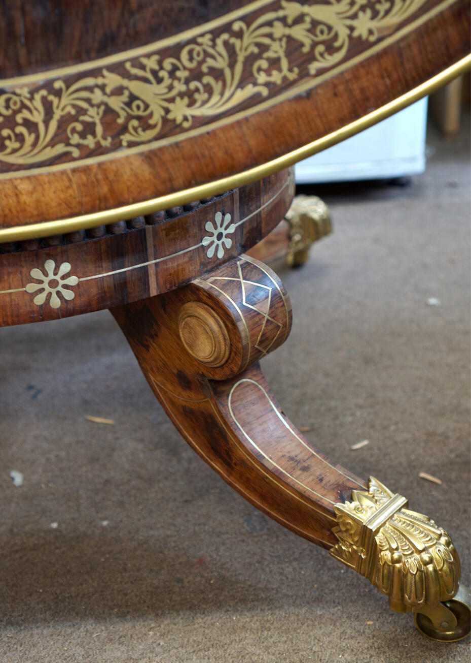 Repairs to a Regency centre table prior to in-painting
