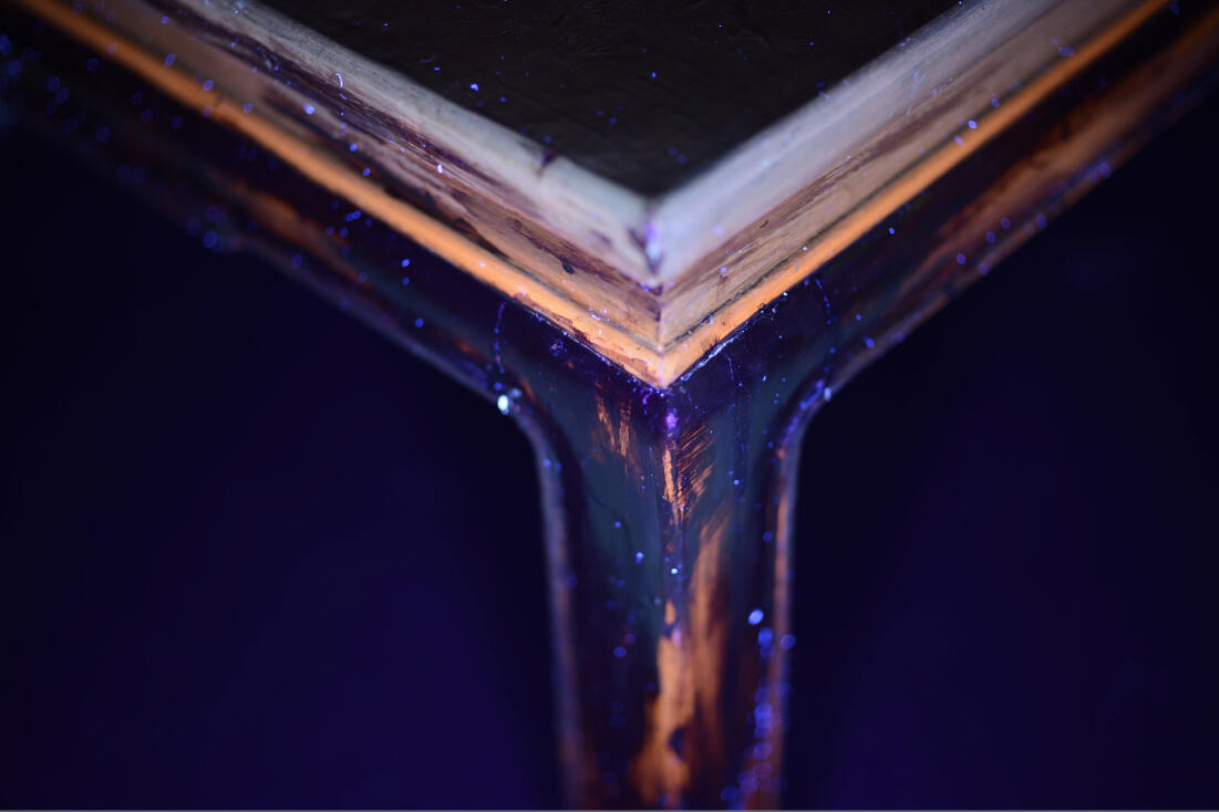 UV light examination revealing multiple coatings